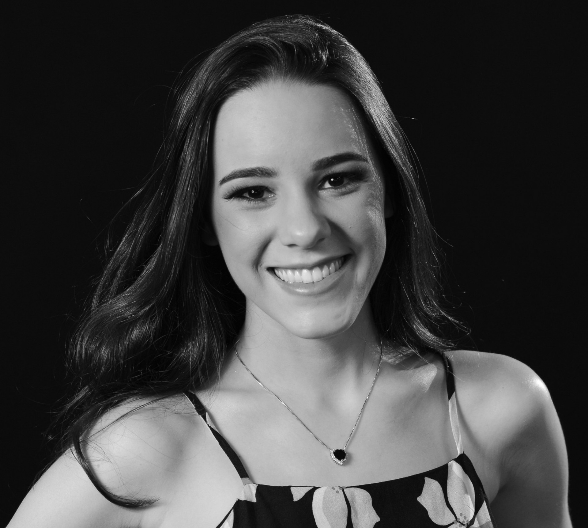 Maria Eduarda Vaz Maria is wearing a flower-patterned dress.